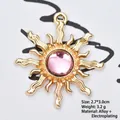 Close-up of golden sunflower charm with pink gemstone inlay, size 2.7x3.0cm, for DIY jewelry - Transparent Pink