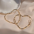Elegant gold twisted heart hoop earrings with a high-shine finish on silk background - E4983 Gold Twisted Heart Hoop