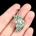 Carved moon face pendant made of natural moss agate with green and white stone texture - Qinghai Jade