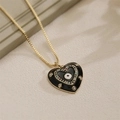 Collier doré avec pendentif cœur en émail noir, motif œil et pierres multicolores - Style Œil Cœur Noir Or