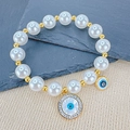 Elegante bracciale di perle bianche con ciondolo a forma di occhio greco in cristallo - Occhio tondo