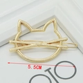 Gold hollow cat-shaped hair clip with whiskers and 5.5cm width measurement detail - Cat Head Gold