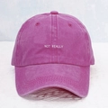 Detailed view of magenta washed cotton baseball cap with white NOT REALLY embroidery - Rose Red with White Logo