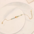 Detail of beaded fish charm bracelet with turquoise accents on marble background - Multi-color Fish Beaded Style(13#)