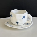 Ceramic coffee cup set featuring hand-painted blue bird pattern and wavy edge - Swallow Bird Cup & Saucer