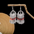 Ethnic style silver hook earrings with hollow leaf tassels and red bead accents - Hollow Heart Feather Tassel Red Beads Style (E6047-01/Red)