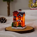 Glow resin Christmas cottage with snowy roof on wood base detail for holiday decor - Style J