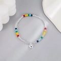 Colorful rainbow beaded bracelet with silver metal beads and a polished heart pendant - Beaded Patchwork Heart Bracelet