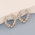 Detailed view of silver heart-shaped stainless steel hoop earrings with a polished finish - Silver Style K7-33