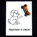 Tiger eye dog bone stone on cartoon card with Happiness is simple quote - Tiger's Eye