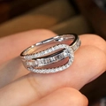 Luxurious crisscross silver ring with baguette and round cubic zirconia stones - US 7 / White Gold