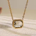 Detailed close-up of a gold necklace with a large emerald-cut zircon stone pendant - Clear Rectangular Style (BD025-White)