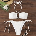 Close-up of white waffle texture bikini fabric with decorative seashell ties on wood - S / White