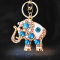 Sparkling crystal elephant keychain in gold metal with blue gems and white enamel detail - Single OPP Bag Packaging / Crystal Elephant Blue
