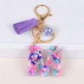 Resin initial M keychain with purple tassel and colorful stones on a white background - Letter M(5859543255621)