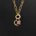 Gold plated stainless steel necklace featuring a letter Q and pink gemstone pendant - Letter Q