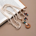 Bohemian hand-woven tassel belt with turquoise beads and wood rings on book - X492-1 Off-white