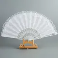 Elegant white lace folding fan with ornate silver hollowed-out ribs and wooden stand - Double Layer White Lace Fan - Without Tassel