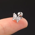 Macro shot of silver butterfly ear stud with clear zircon stones on a black background - CC016-1 Silver Bow Knot
