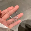 Silver double layer necklace with butterfly zirconia pendant on delicate cross chain - Snowflake Necklace