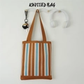 Brown knitted tote bag with blue and white stripes hanging on a white wall hook - Khaki Blue Fine Stripe