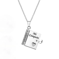 Detail of silver book-shaped pendant with Mi Campeón engraving and heart cutout - 09-1-3 Silver Spanish My Champion Son