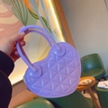 Detail of purple heart-shaped jelly bag with quilted pattern in casual setting - 17*5.5*11cm / Purple