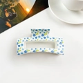 Square hair claw clip featuring blue floral patterns on a clean white finish - Cream White Blue Floral