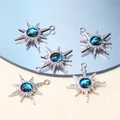 Detailed macro view of silver star charms with blue stone and sparkling crystal inlays - Style 12-Galaxy Eight-pointed Star