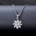 Elegant silver flower necklace with marquise-cut zircons hanging on a textured display - Tl97 (with Chain)