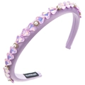 Detailed close-up of purple satin headband featuring crystal hearts and pearls - Purple