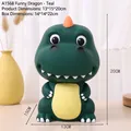 Grüne Cartoon Dino Spardose für Jungen mit orangen Zacken und runder Form - Lustiger Drache / Cyan