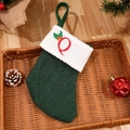 Forest green knit Christmas stocking with white cuff and red embroidered letter O - Letter Q