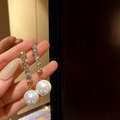 Elegant silver drop earrings with stacked sparkling crystals and a large iridescent pearl - Silver Long Rhinestone Pearl Dangle Style