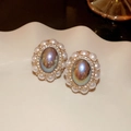 Detailed macro view of vintage baroque gold earrings with grey stones and pearls - Gold Oval (Silver Pin)
