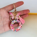 Pink resin butterfly keychain with gold hardware, colorful sequins and fringe tassel - Butterfly Tassel 8-Shape Buckle / Letter O
