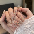 Long oval nude press-on nails with 3D iridescent butterfly and rhinestone accents - HY293 Nude 3D Magic Butterfly