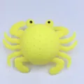 Yellow crab-shaped squeeze toy for bath time, made of soft silicone material - Yellow Bath Crab