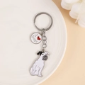 Detailed close-up of a metal dog keychain with I Love Dogs charm and Schnauzer pendant - Terrier Schnauzer (M10203)