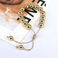 Bracciale dorato regolabile con perle geometriche lucide da 6mm a 10mm in metallo - Diametro della perla 10mm / Oro