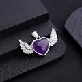 Natural amethyst heart pendant with silver angel wings on a dark textured surface - Amethyst