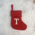 Red knitted Christmas stocking with white plush letter T and a convenient hanging loop - Letter T