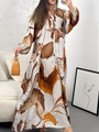 Detail of the elegant V-neckline and abstract print on this long sleeve flowy dress - S / Dresses / Coffee