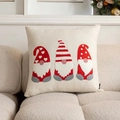 Beige tufted Christmas pillow with three embroidered gnomes on a cozy sofa - Chenille Three Gnomes