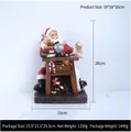 Santa Claus at wooden desk resin ornament with globe and teddy bear, 19x18x26cm - Santa Sitting At Desk