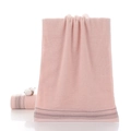 Thick light pink cotton towel with gray stripes and natural cotton ball accents - Gift Pink