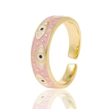 Detailed macro view of gold adjustable ring with pink enamel and evil eye patterns - Pink