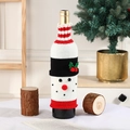 Knitted snowman wine bottle cover with red nose and striped scarf for Christmas decor - Snowman