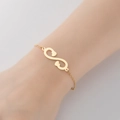 Minimalist gold infinity heart bracelet in polished finish worn on the wrist - 347-Infinity Heart