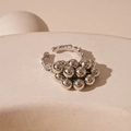 Macro view of silver pleated irregular ball ring with handcrafted hammered texture - Open Ring / Silver